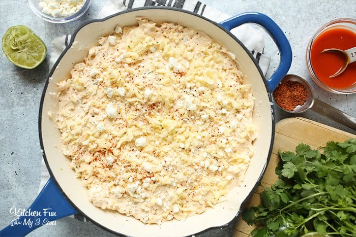 Skillet Mexican Corn Dip is a creamy and spicy dish perfect for get-togethers and football parties. Everyone that loves a little kick will enjoy this!