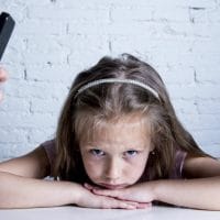 A Parent’s Use of Tech May Lead to Big Problems for Kids