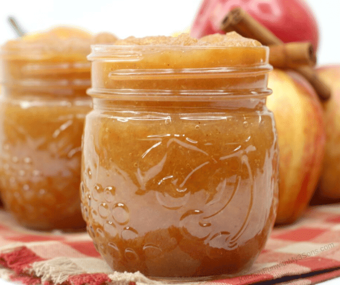 p close image of a mason jar of applesauce after you learn how to make applesauce in the slow cooker