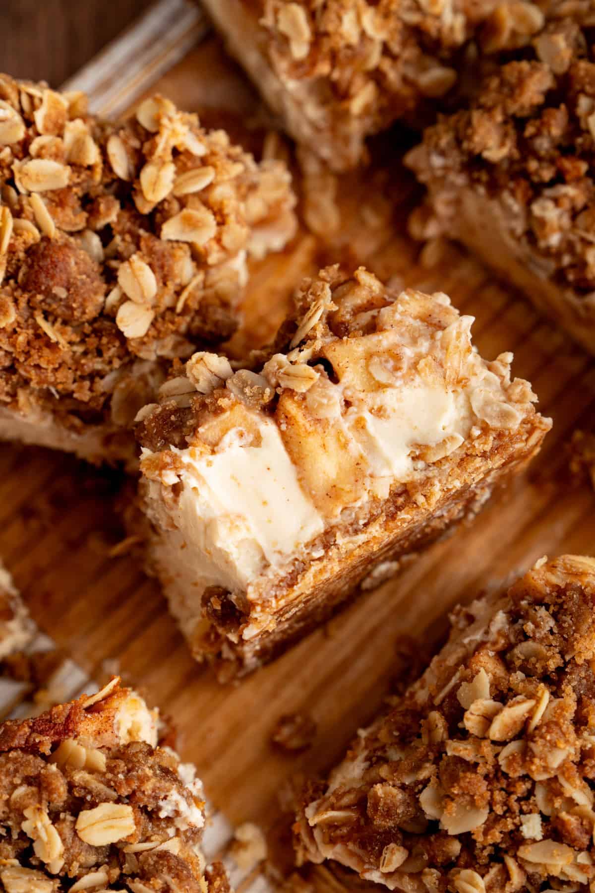 These Caramel Apple Cheesecake Bars combine creamy caramel cheesecake with cinnamon-spiced apples and a buttery oat crumble. Baked Caramel Apple Cheesecake Bars