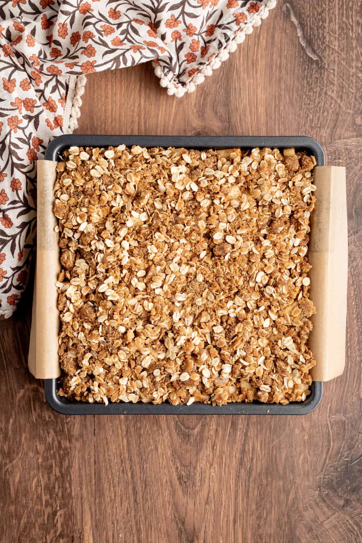 These Caramel Apple Cheesecake Bars combine creamy caramel cheesecake with cinnamon-spiced apples and a buttery oat crumble. crumble topping added on top of the cheesecake before baking.