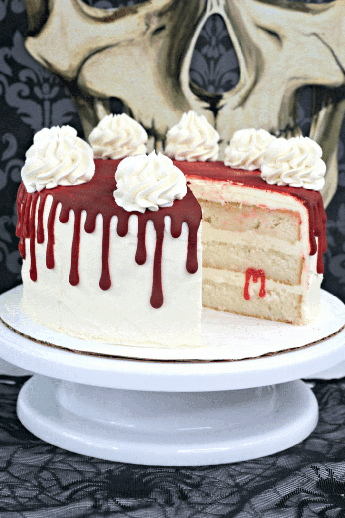 Collage image of slices of vampire blood cake on a white cake stand