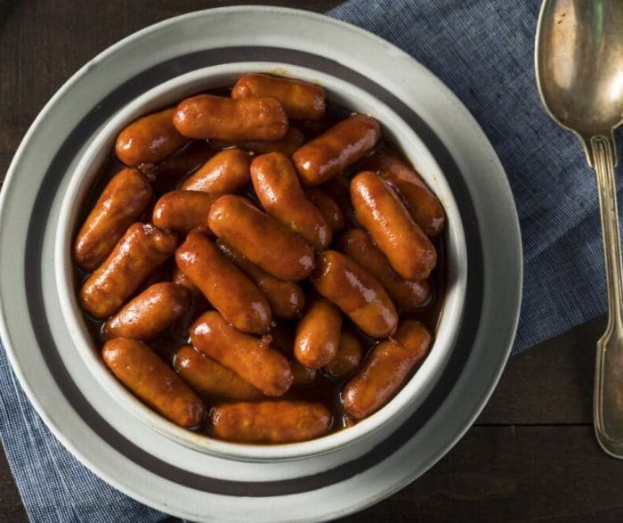 A white and gray bowl filled with barbecue mini smoked sausage