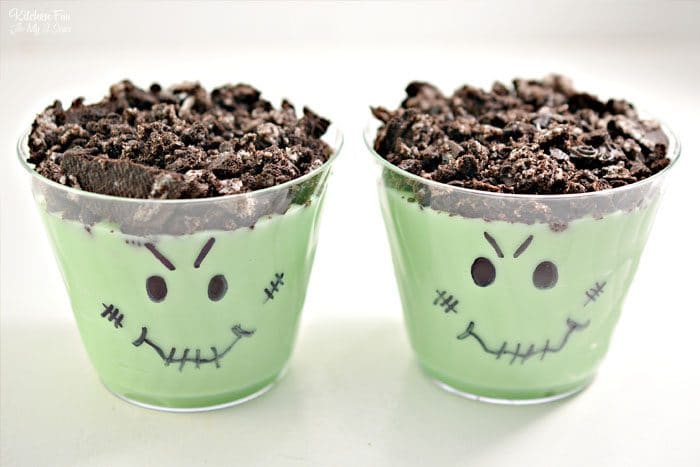 These Halloween Pudding Cups with Oreo cookies are a really fun treat to make with kids. Grab a marker and let's make a Jack-O-Lantern and Frankenstein!