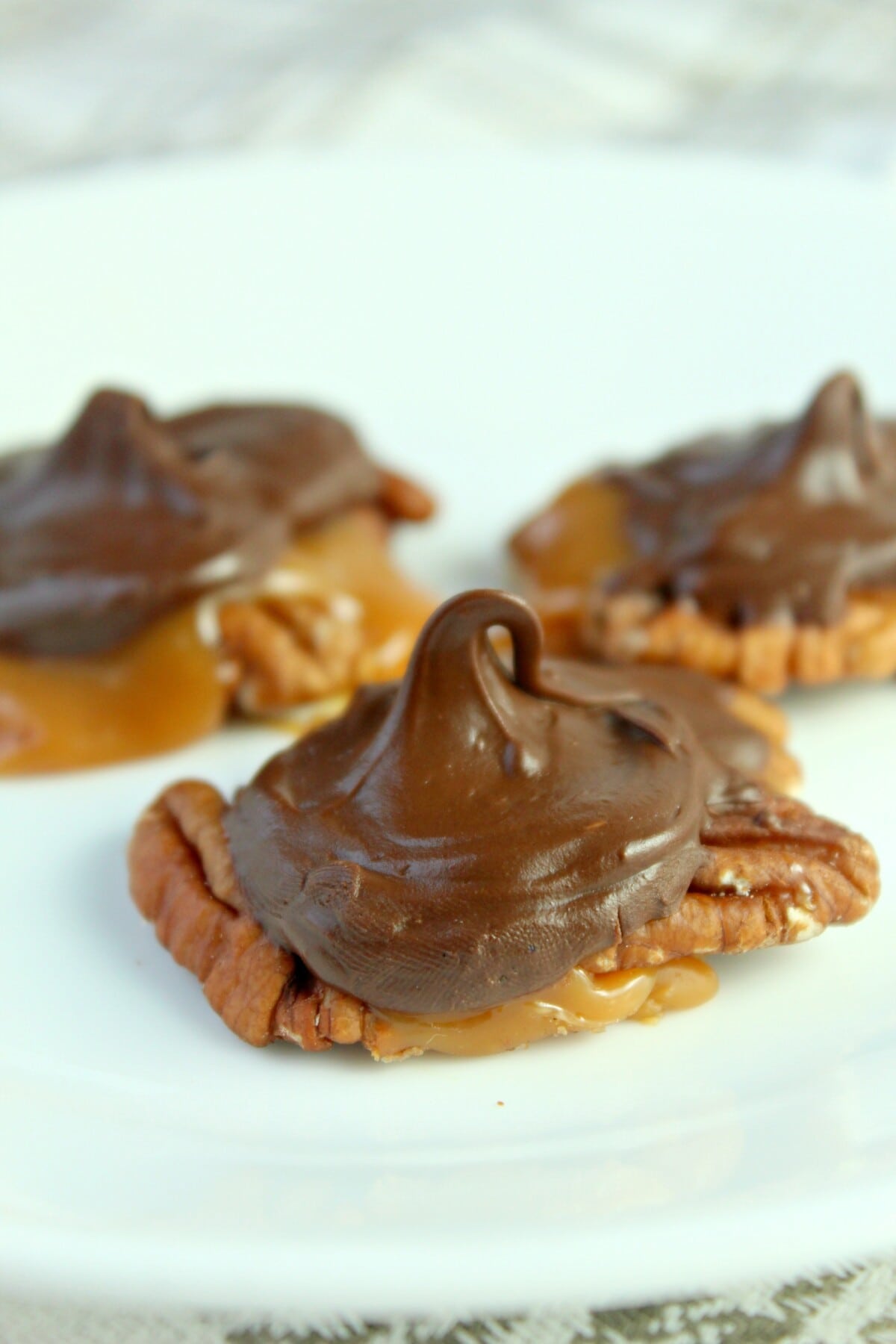 Chocolate Turtle Pecan Clusters on a plate
