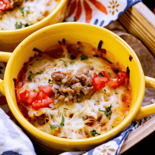 Overhead picture of baked lasagna casserole in a yellow crock