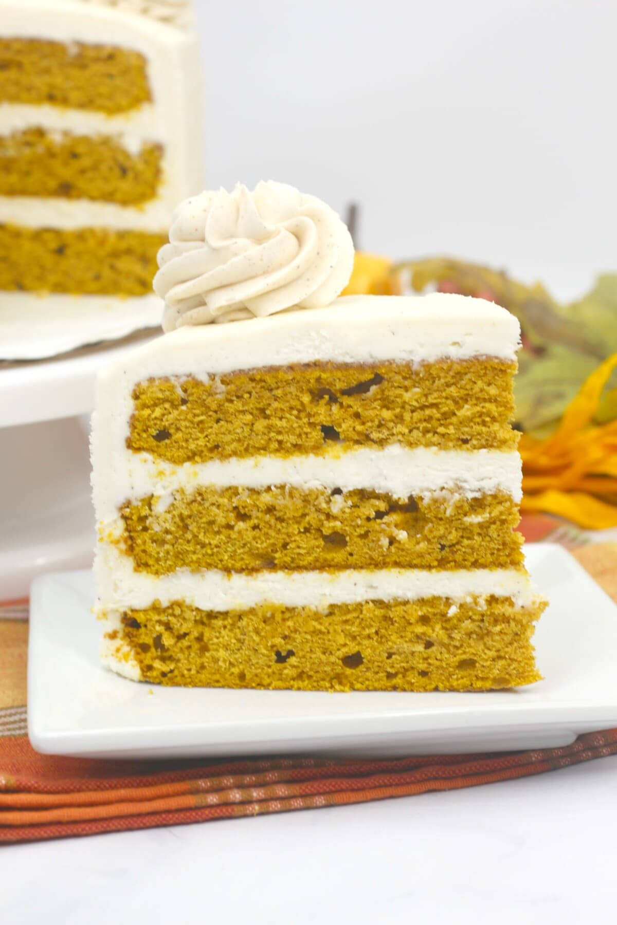 Pumpkin Layer Cake on a square plate.