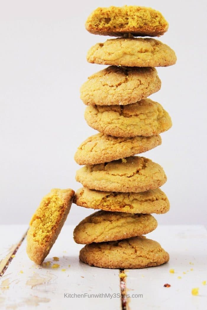 Stack of pumpkin spice sugar cookies on a white wooden surface