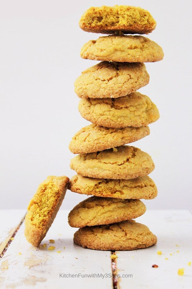 Stack of pumpkin spice sugar cookies on a white wooden surface