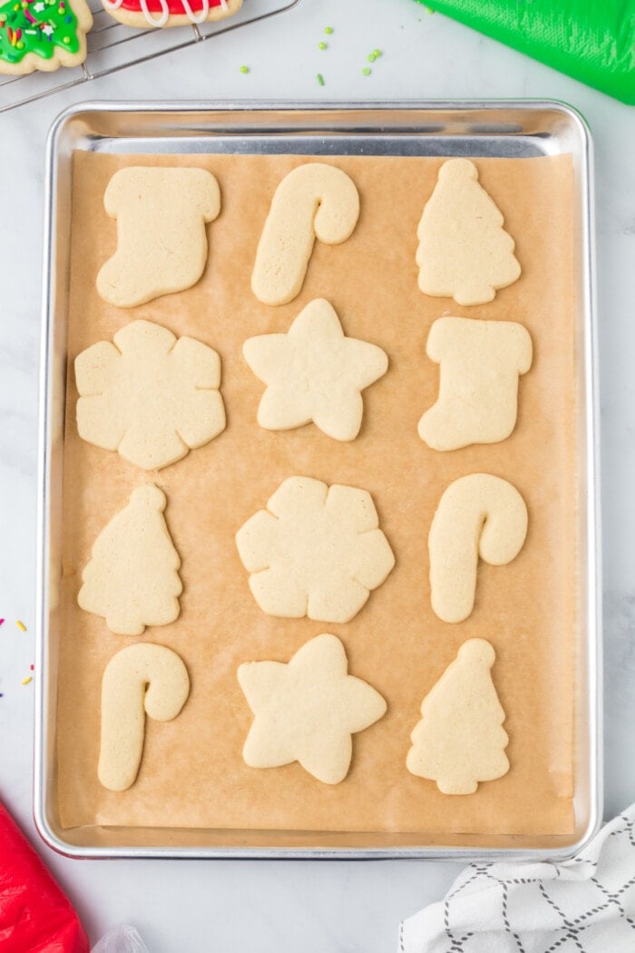 Baked cut out sugar cookies on a baking sheet