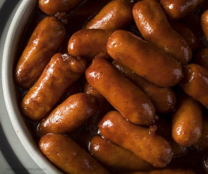 Up close picture of BBQ Lil Smokies in a white bowl