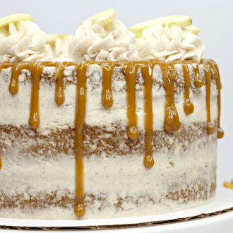 Up close picture of a layered apple spice cake on cake stand