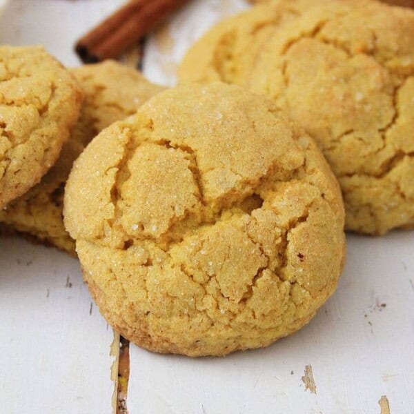 Up close picture of pumpkin spice sugar cookies on wooden table