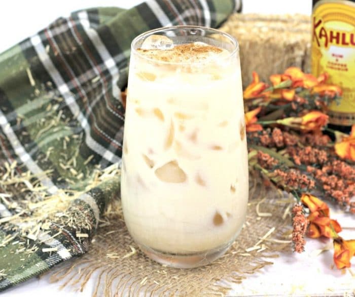 White russian cocktail with pumpkin and a dash of pumpkin spice on top