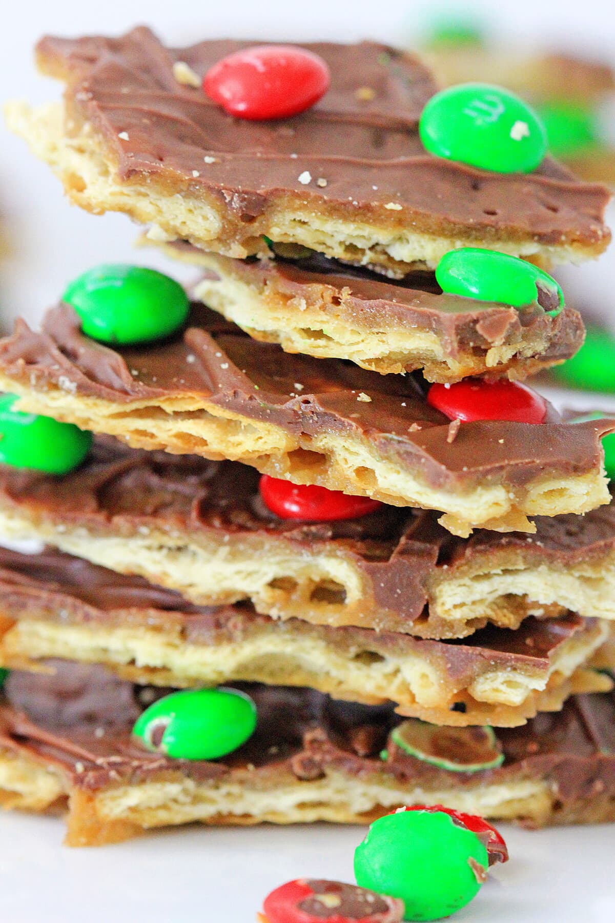 close up of stacked Christmas Crack Toffee