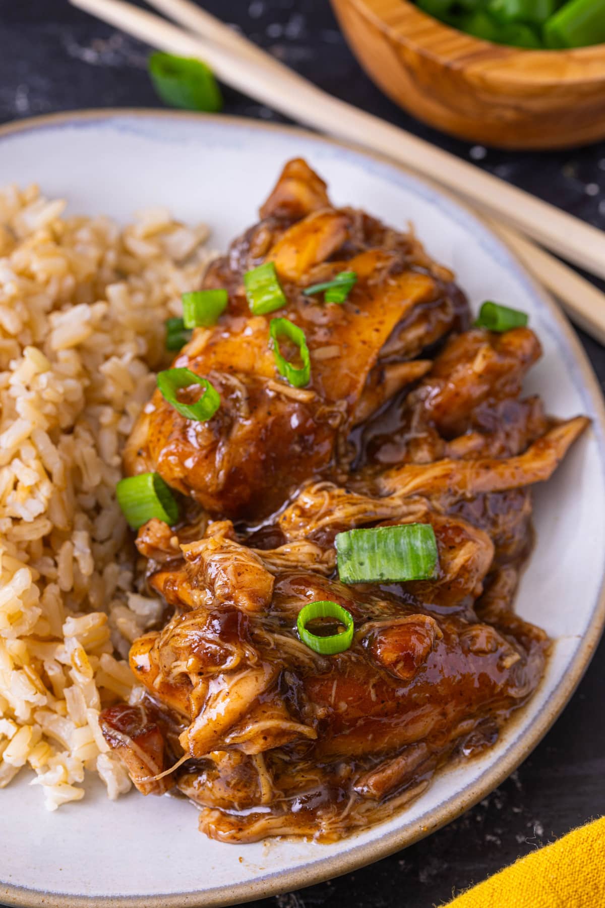 Crock Pot Bourbon Chicken on a plate with rice