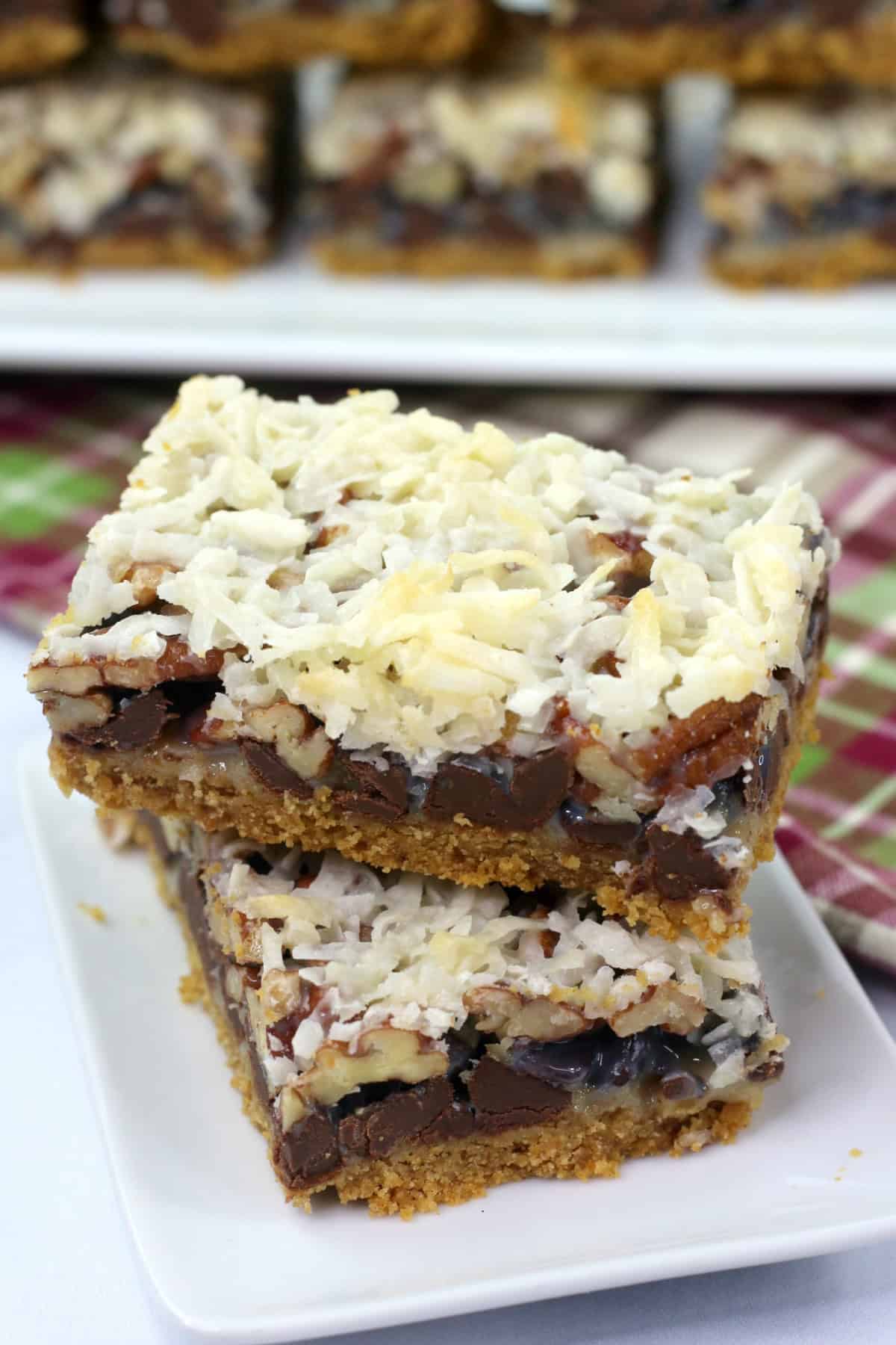 These Hello Dolly Bars are loaded with chocolate chips, coconut, and crunchy pecans over a buttery graham cracker crust. top view of Hello Dolly Bars.