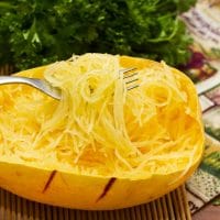 Cooked spaghetti squash on a fork.