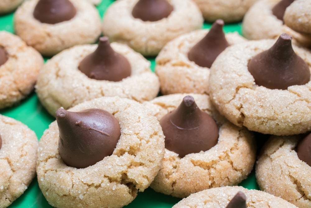 Peanut Butter Blossom Cookies on a green background