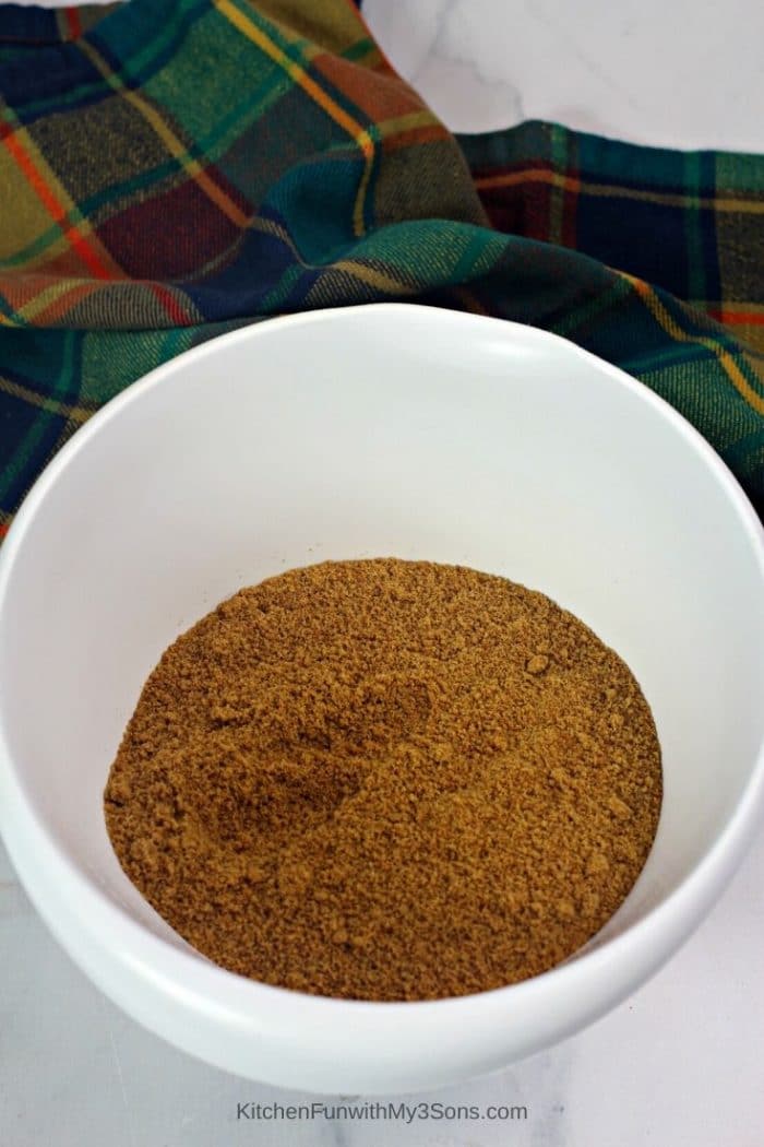 A white bowl filled with gingersnap crumbs for making gingerbread truffles