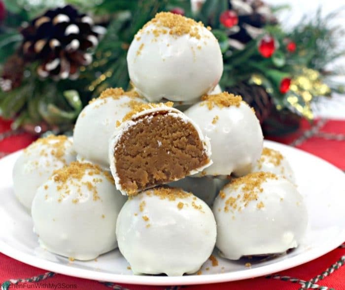 A white plate filled with white chocolate gingerbread truffles