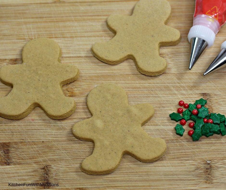 Blank gingerbread man cookies on a cutting board