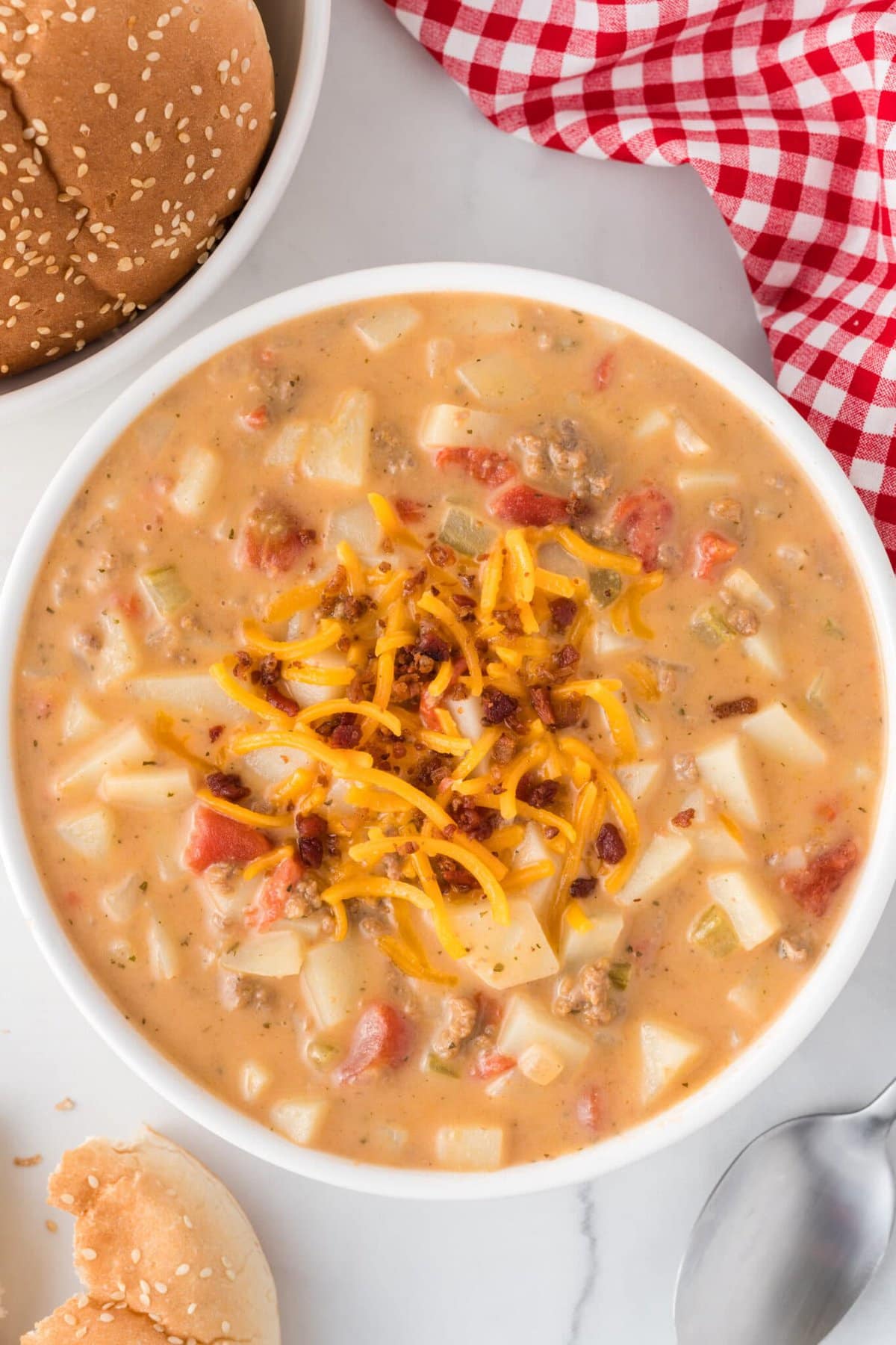 Overhead view of a bowl of cheeseburger soup 