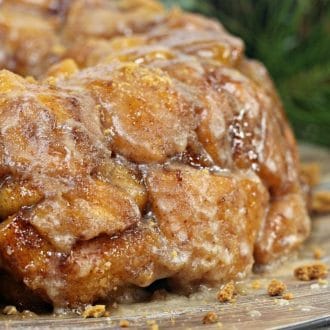 Gingerbread monkey bread on a wooden tray with greenery in the background (1)