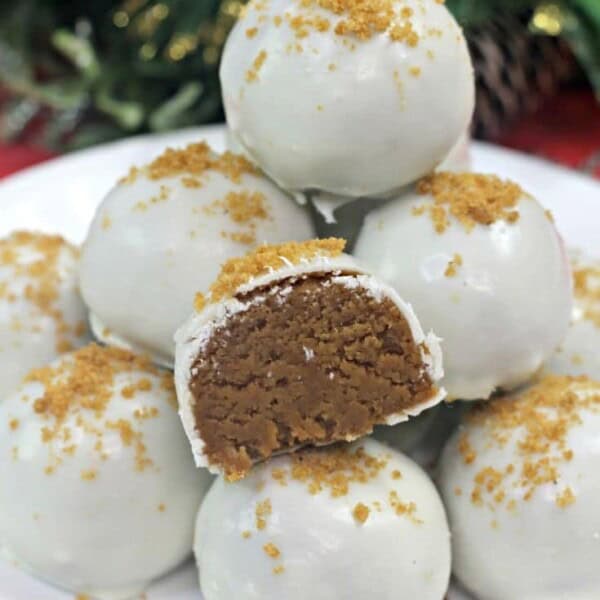 Gingerbread truffles stacked on a white plate