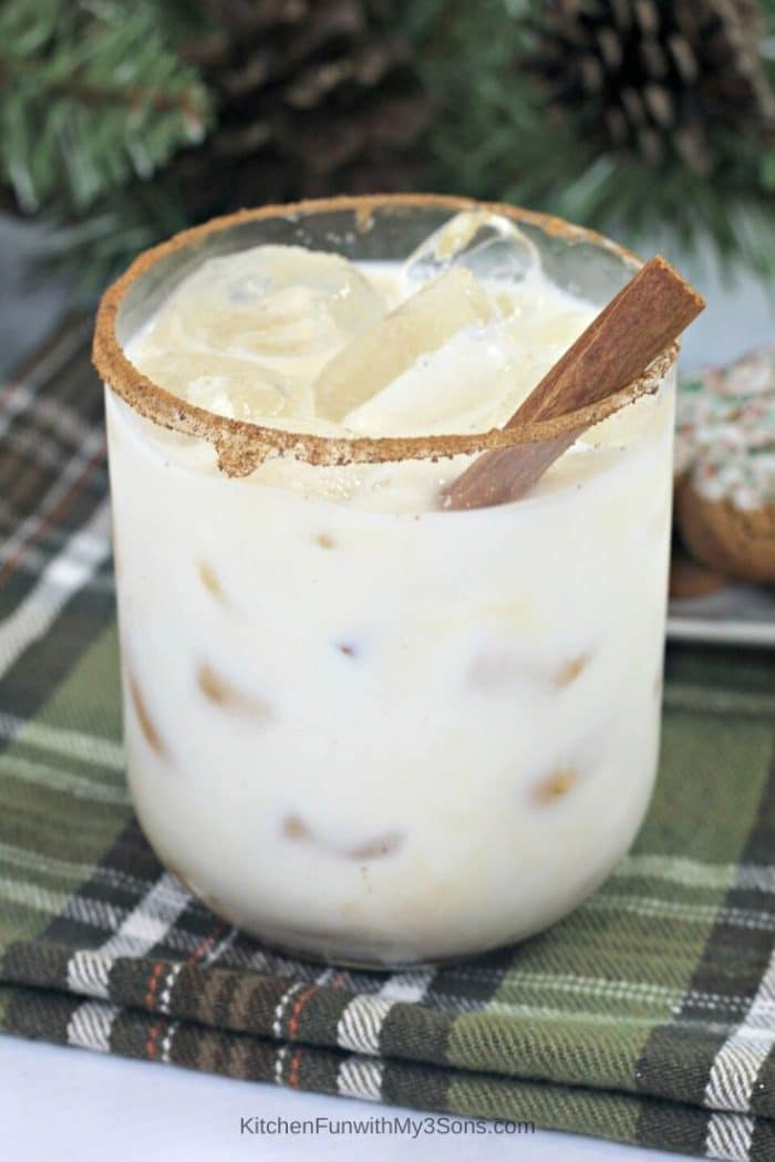 Gingerbread white russian sitting on a green plaid cloth