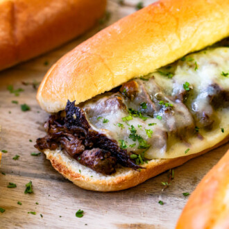 A french dip sandwich with melted cheese