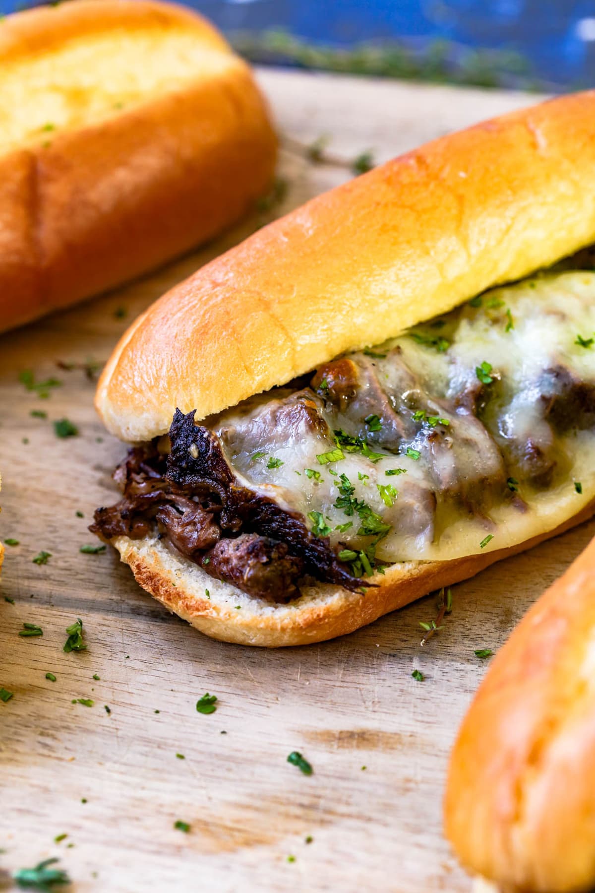 A french dip sandwich with melted cheese