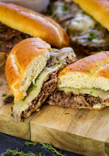 A slow cooker french dip sandwich cut in half