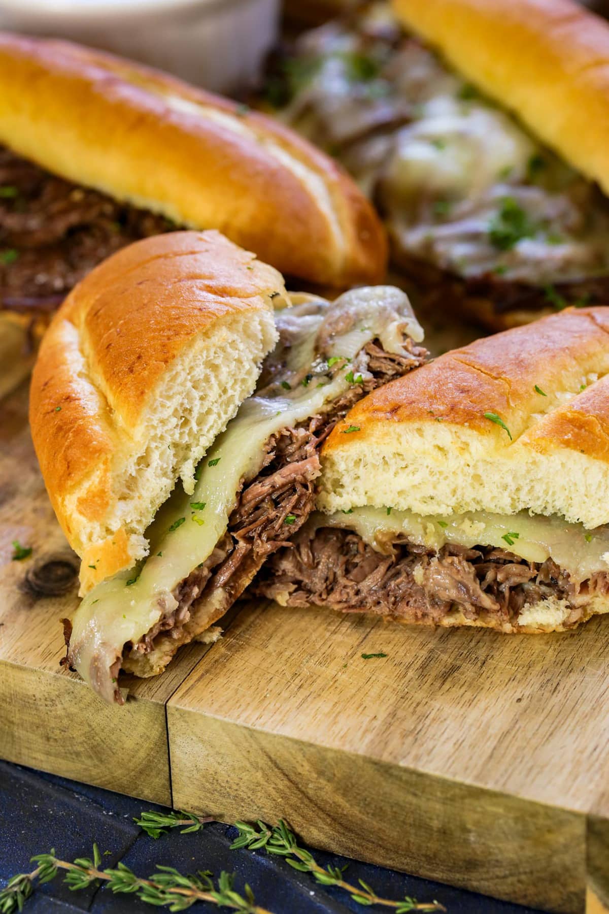 A slow cooker french dip sandwich cut in half
