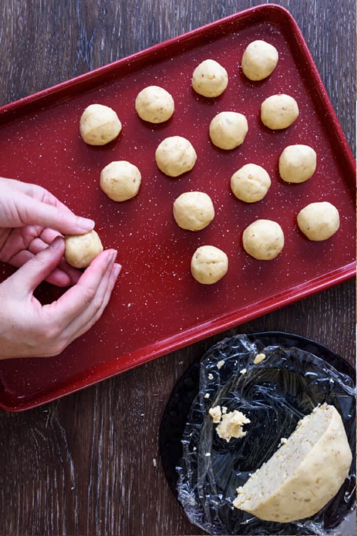 Shaping cookie dough into small balls