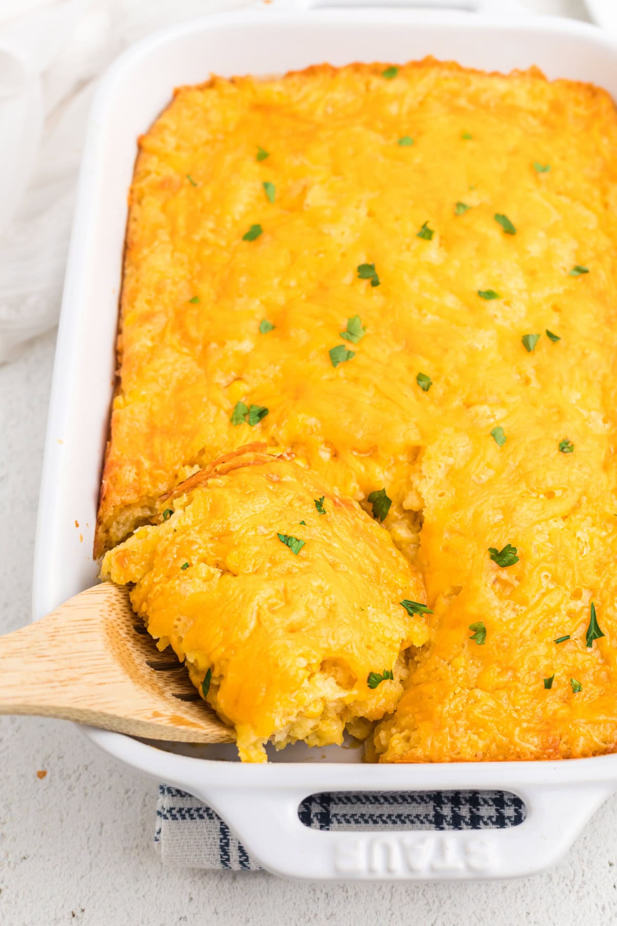 Made with just 6 ingredients, this Cheesy Corn Casserole is a must-make for every holiday. Only 5 minutes of prep! Corn Casserole in a baking dish