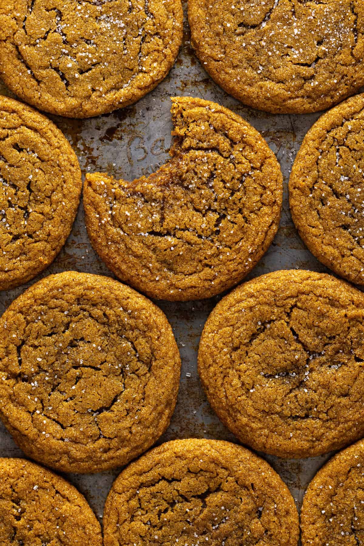 top view of Molasses Cookies with a bite taken out of one