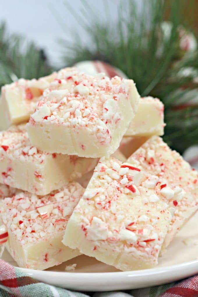 Overhead picture of candy cane fudge squares on a white plate