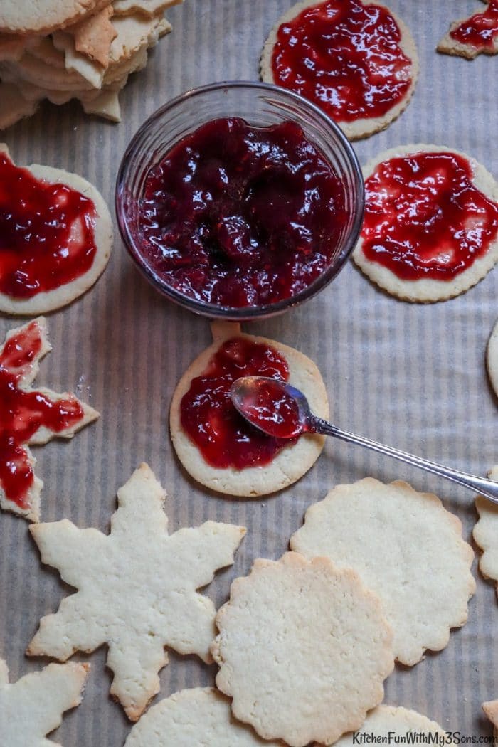 Adding raspberry jam to linzer cookies