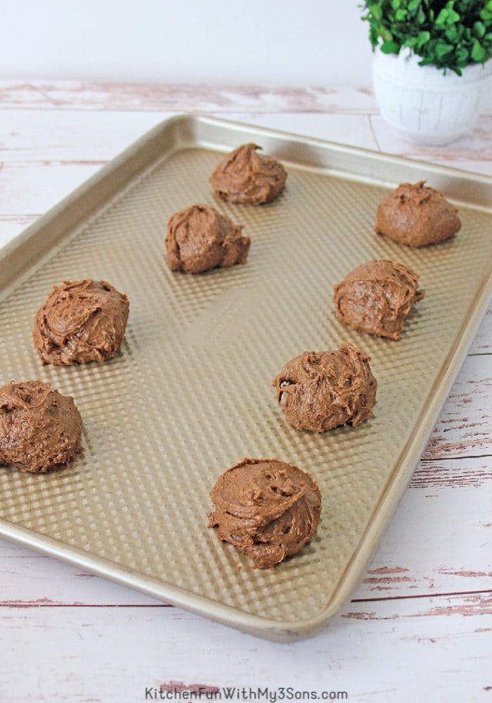 Brownie batter cookies on baking sheet