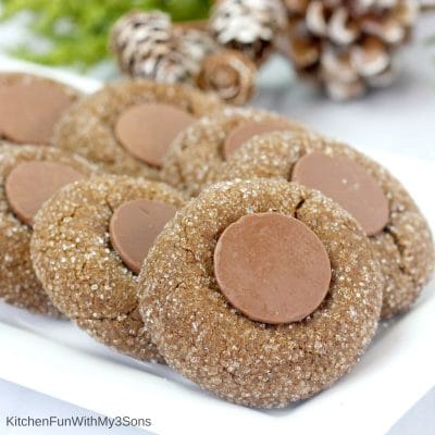 Gingerbread thumbprint cookies on a white plate