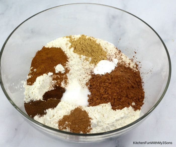 Ingredients for gingerbread cookies in a large bowl