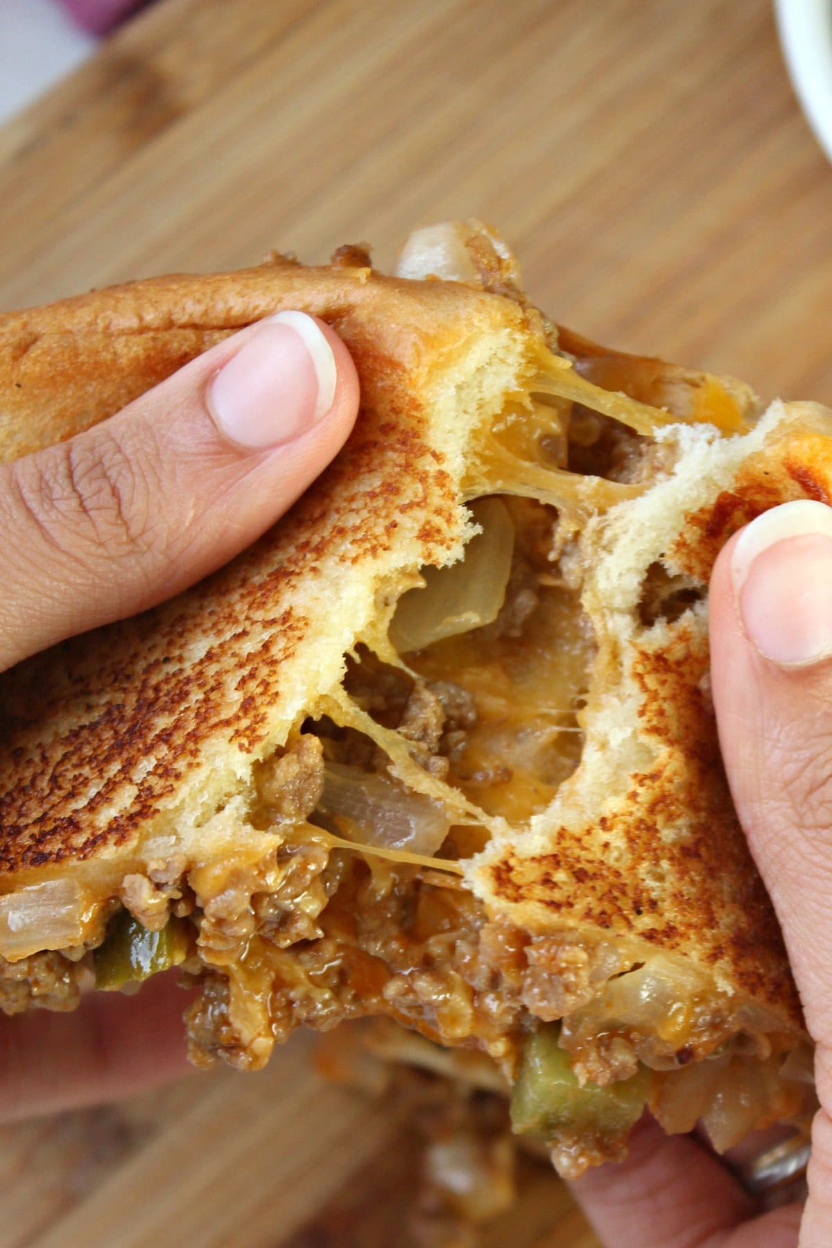 breaking a sloppy joe grilled cheese in half