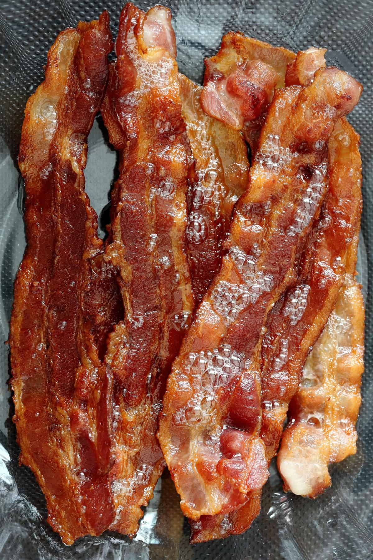 Slices of cooked bacon
