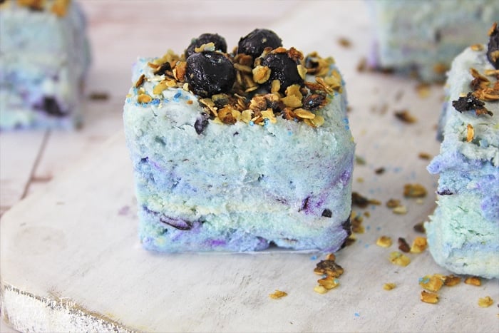 Blueberry Muffin Fudge brings two old favorites together in a beautiful dessert recipe. Full of fresh blueberries and topped with honey coated oats.
