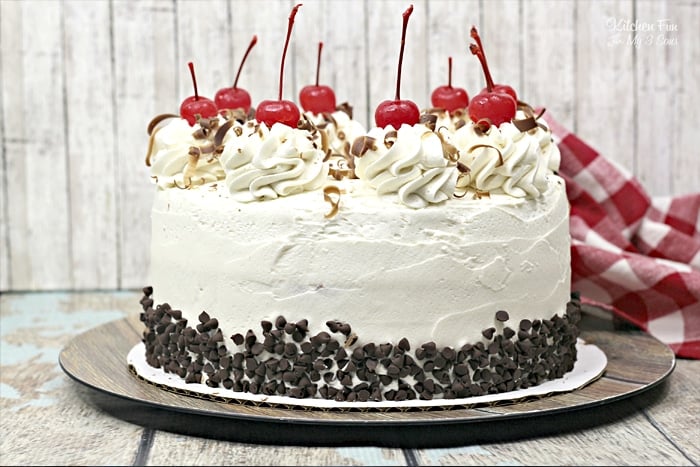 Cherry Garcia Cake with cherries on top on a wood table