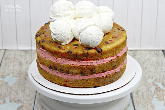 Cherry Garcia Cake is stacked with layers of vanilla cherry cake and homemade cherry icing. This cake looks like it came straight from a bakery!