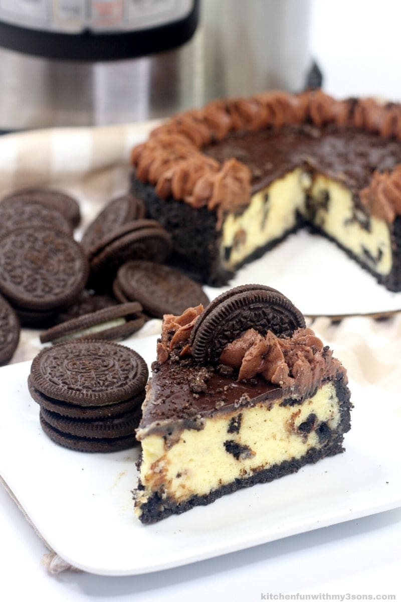 a slice of Instant Pot Oreo Cheesecake on a white plate