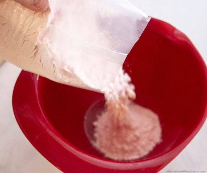 pouring cake mix into bowl