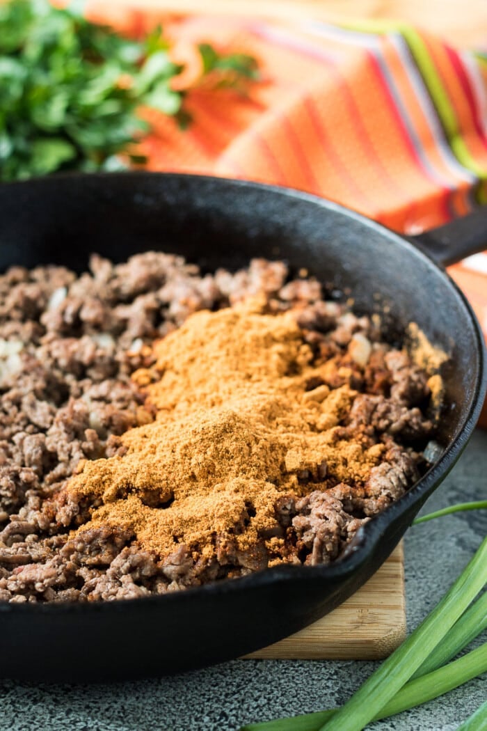 taco seasoning and ground beef in a pan